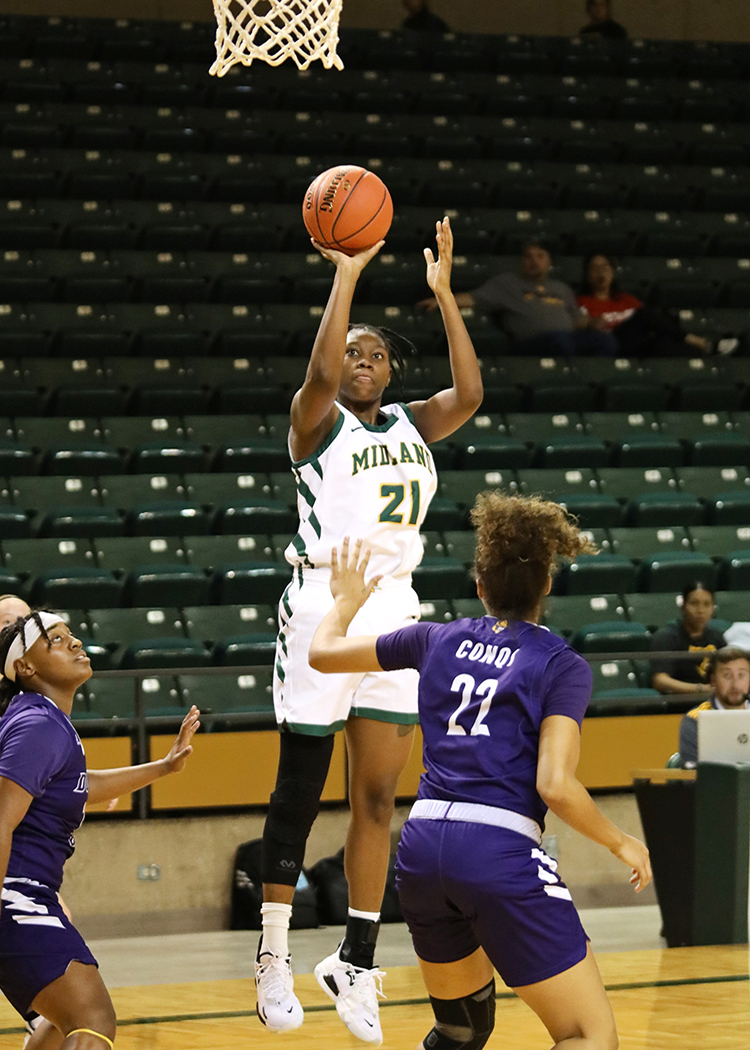Dana Thompson. MC Lady C haparral Basketball, in action.